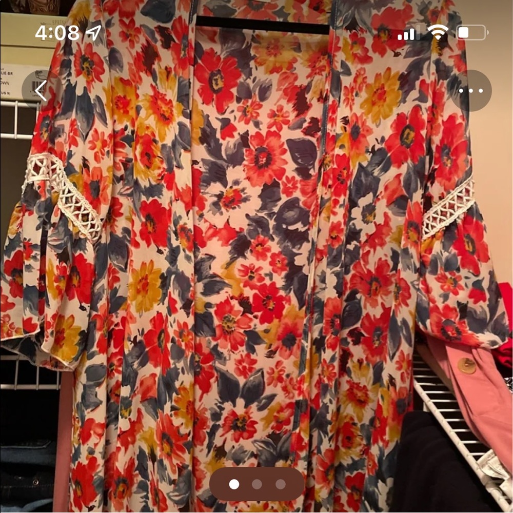 Cute, light material kimono with crocheted inset on sleeves.